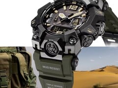 Крупный план часов Casio G-Shock Mudmaster GWG-B1000-1A3, демонстрирующий их чёрный корпус, акценты на циферблате цвета светло-коричневого, оливково-зелёный ремешок, прочные защитные накладки и надпись «Triple Sensor» на фоне военного снаряжения и пустынного пейзажа.