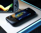 Steam Deck, отображающий главный экран SteamOS, лежит на светящемся белом столе рядом с различными портативными игровыми ПК на базе Windows, включая устройства ASUS ROG Ally и Ayaneo. (Источник изображения: Notebookcheck)