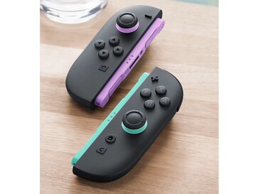 Новые Joy-Cons имеют светло-фиолетовые и светло-зеленые акценты на направляющих и джойстиках. (Источник изображения: Nintendo)