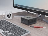 Стоимость Nano Pro Gen 14 начинается от €840. На фото: мини-ПК рядом с монитором, клавиатурой, чашкой для чая и ручкой. (Источник изображения: Tuxedo)
