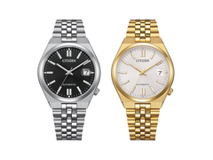 Модель Citizen NK0030-51E с чёрным циферблатом и модель NK0032-56A в золотистом цвете, представленная на фотографии.