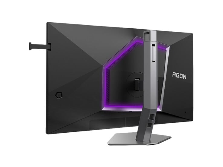 На изображении показана задняя часть игрового монитора AOC Agon Pro AG276UZ, отличающегося ярко выраженным игровым дизайном с фиолетовой подсветкой RGB. 