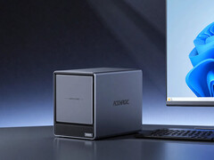 N3A имеет четыре отсека для дисков SATA и два слота для SSD M.2. На фото: рекламная фотография, на которой NAS расположен рядом с монитором.