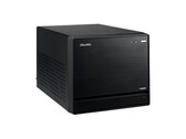 На изображении показан вид с головы на Shuttle XPC Mini PC, который выглядит как черный куб с минимальным дизайном. 