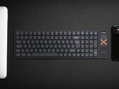 Беспроводная механическая клавиатура Iqunix Magi96 на столе с другой техникой
