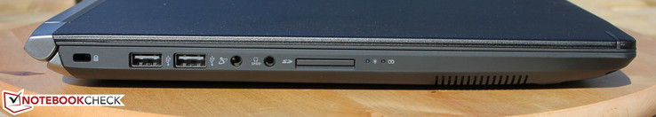 Слева: слот замка Kensington, 2x USB 2.0, гнездо микрофона, 3.5 мм аудио разъем + SPD/IF