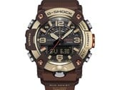 Крупный план часов G-Shock Mudmaster GG-B100XMH-5A, демонстрирующий их корпус и безель светло-желто-золотого и коричневого цветов.