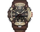 Крупный план часов G-Shock Mudmaster GG-B100XMH-5A, демонстрирующий их корпус и безель светло-желто-золотого и коричневого цветов.