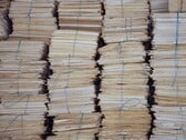 Высокие стопки бумажных папок, перевязанных бечёвкой