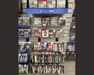 Проход в магазине GameStop, заполненный физическими играми для PS3