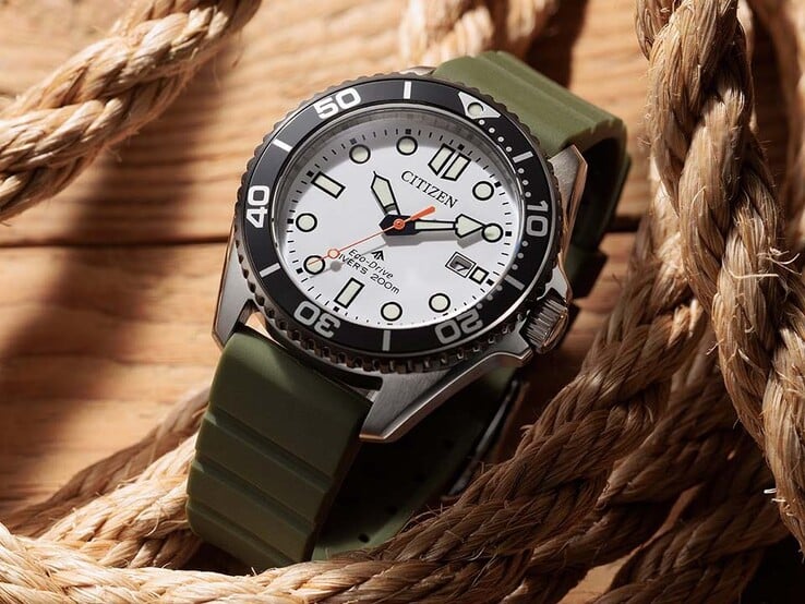 Часы Citizen Promaster Marine BN0265-00A для дайвинга с белым циферблатом, чёрным безелем, корпусом из нержавеющей стали и оливково-зелёным ремешком, выполненным в виде спиральной верёвки.