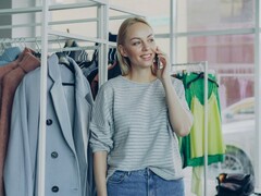 Декоративное изображение. Человек стоит в магазине одежды