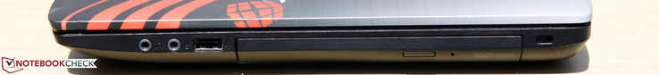 Справа: аудиовыход, аудиовход, USB 2.0, DVD-привод, слот замка Kensington