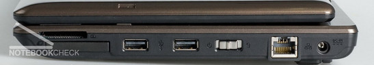 Справа: Картридер, Expresscard, 2 USB 2.0, кнопка включения и блокировки клавиатуры, LAN, разъем питания