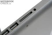 В отличие от белого MacBook'а появился считыватель SD карт по соседству с FireWire портом.