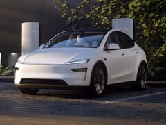 Новая Tesla Model Y у зарядного устройства Supercharger. (Источник изображения: Tesla)