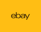 Логотип eBay, изображенный на желтом фоне