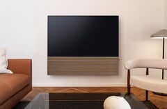 Компания Samsung комплектует OLED-телевизор S99H стильной звуковой панелью с деревянной передней панелью.