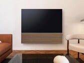 Компания Samsung комплектует OLED-телевизор S99H стильной звуковой панелью с деревянной передней панелью.